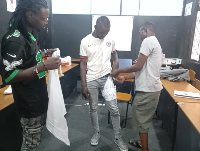 Participants practising first aid during a Lifeline First Aid training session.